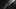 Grayscale photo of a person walking towards the light