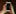 Two hands holding a phone with a blank screen,. the image is glitchy.